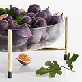 Fresh Purple Figs in Glass Bowl with Golden Stand and Sliced Fruits with Green Leaves