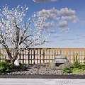 Wooden Garden Wall with Blooming Tree Stone Mill Gravel and Green Plants Under Blue Sky
