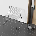 Modern Sleek Metal Leisure Chair Design With Dark Tile Floor White Wall Small Cat Nearby