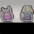 Two Cute Monster Figurines With Pink Purple Designs And Silver Speckled MONSTER Bases