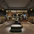 Modern Stylish Clothing Store Interior Featuring Fashion Apparel Display Racks And Warm Lighting