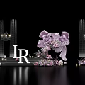 Elegant Wedding Stage Setup With Purple Pink Florals White Letter IR Chandeliers And Decorative Pillars