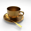 Golden Metallic Cup With Saucer And Spoon On White Background