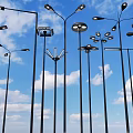 Roadside Lighting Facilities With Multiple Street Lamps Under Blue Sky And White Clouds