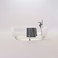 Transparent Bathtub With Modern Metal Faucet And Gray Towel Design
