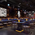 Modern Chic Bar Interior With Blue Lighting Black Furniture And Neon Decor
