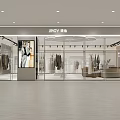 Modern Clothing Store Window Display With Dressed Mannequins Green Plants And Bright Lighting