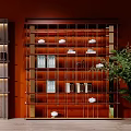 Shelving Units With Red Background Grid Design Tea Sets Books Decorative Items And Green Plant