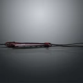 Red Bladed Weapon With Black Rope Wrapped Handle And Leather Cord Tail