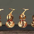 Decorative Gourd Shaped Ornament Set Featuring Colorful Patterns On Wooden Surface