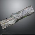Weathered Wooden Log With Green Moss Growth And Metallic Surface Texture