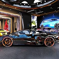 Aventador Sports Car On Rotating Platform With Large Screen Display