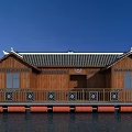 Chinese Style Wooden House with Traditional Roof on Water Featuring Red Buoys and Decorative Railings