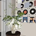 Bonsai Potted Plant with Mixed White Purple Blue Flowers and Black Vinyl Records Wall Decor