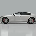 White Luxury Sedan With Sleek Aerodynamic Body And Sporty Alloy Wheels Design