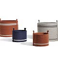 Various Colored Woven Storage Baskets With Striped Accents For Home Organization