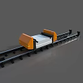 Industrial Equipment With Orange And White Components On Black Track System