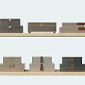 Wooden Decorative Ornament Set with Stacked Multicolored Boxes and Metal Clasps on Shelves