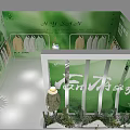 Green Exhibition Booth with Fairy Text Clothing Display and Cacti Plants Decorations