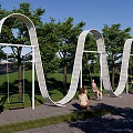 Outdoor Arched Swing Play Equipment With Curved Design For Children Playing In Park