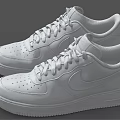 Pair of White Leather Low Top Sneakers With Lace Up Design And Comfortable Sole