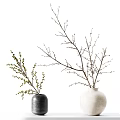 Elegant Floral Display with Two Vases Holding Branches and Small Yellow Flowers