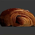 Freshly Baked Red Croissant with Shiny Golden Surface and Soft Flaky Layers