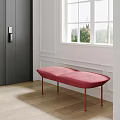 Red Upholstered Bench in Room With White Wall Window Wooden Floor and Dark Door