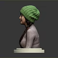 Woman wearing green knitted hat brown turtleneck with braid on white hexagonal base gray background