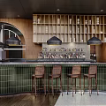 Stylish Bar Interior With Green Tiled Counter Four Wooden Stools And Hanging Black Pendant Lights