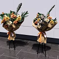 Floral Decorative Arrangement With Brown Paper Wrapped Bouquets Orange Ribbon On Black Stand White Wall