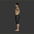 Shirtless Man Flexing Muscular Bicep In Black Shorts Against Gray Background
