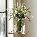 Transparent Glass Vase With White Flowers On Gold Table By Snowy Window With Pine Trees