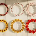 Decorative Ornament Set with Various Colored Circular Wreaths and Multiple Styles on Wooden Background
