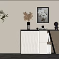 Elegant Entryway Console Cabinet with Woven Panel Vase Floral Art Black Sculpture and Books