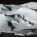 Scenic Snow Covered Mountain Landscape With Glacier Peaks And White Rocky Terrain