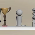 Gold Copper Trophies and Medals with Red Ribbon Spherical and Geometric Design on Shelf