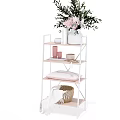 Multilayer Shelf Unit With Green Plant White Bowl Woven Basket And Folded Towel