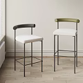 Modern Bar Stools With Curved Black And Green Backrests White Upholstered Seats And Metal Frames