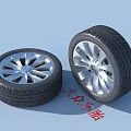 Two Volkswagen Tires With Silver Alloy Rims And Detailed Tread Pattern