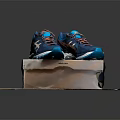 Blue Running Shoes With Multi Colored Laces And Supportive Sole On Brand Box
