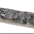 Burned Debris Of Damaged Item On Road Surface With Charred And Broken Parts