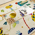 Glass Top Coffee Table With Wooden Legs And Yellow Bowl On Colorful Patterned Rug