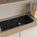 Modern Kitchen Appliances With Black Four Burner Induction Cooktop And White Coffee Maker On Countertop