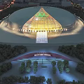 Cultural Center Building with Unique Glass Dome Illuminated at Night Surrounded by Green Trees and Plaza