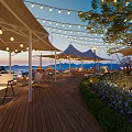Garden Landscape With Wooden Deck White Canopies String Lights Loungers Greenery And Evening Mountain Views