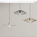 Three Modern Unique Design Pendant Lights Hanging On Light Colored Wall Interior