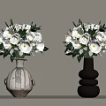 Two Decorative Vases With White Roses And Green Leaves On Light Surface