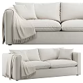 Cozy Light Colored Two Seater Sofa with Soft Pillows and Fringe Blanket