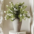 Gray Concrete Vase With White Flowers And Green Foliage On White Round Minimalist Stand